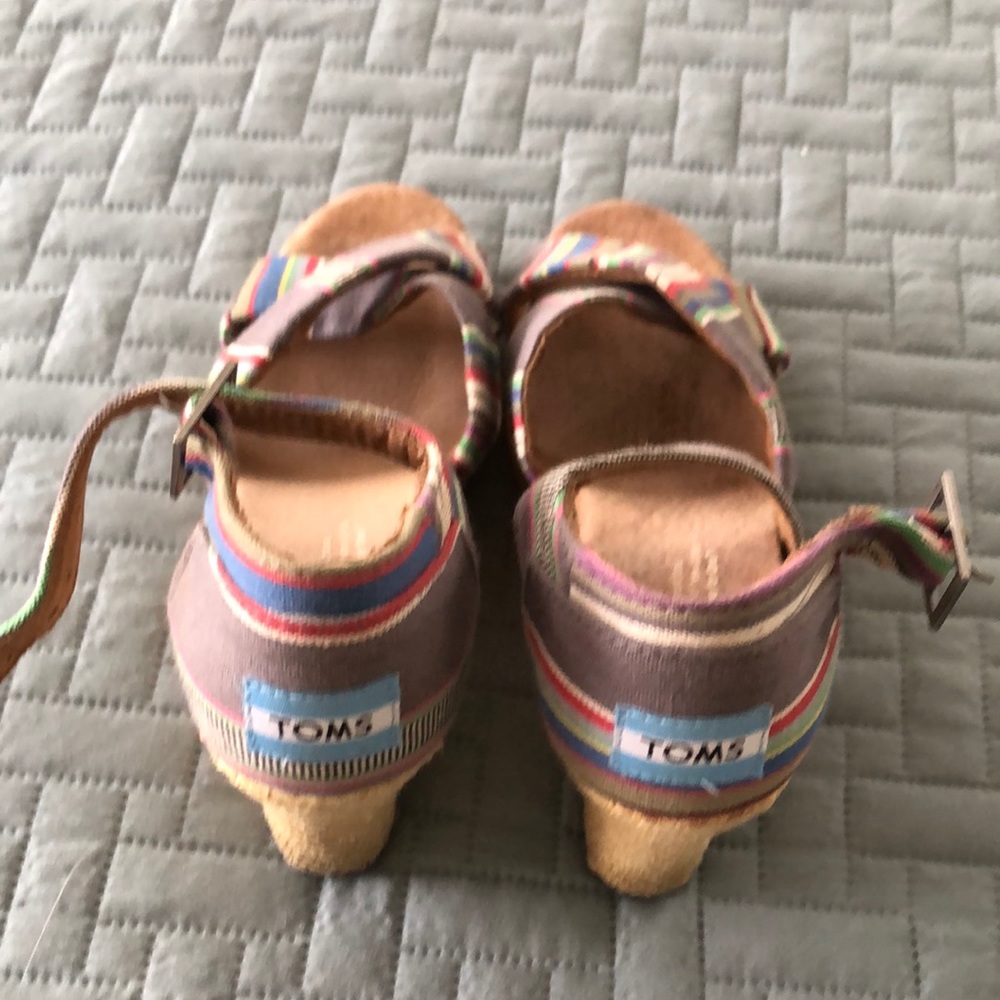 Tom’s multicolored wedge sandals.